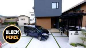 モダンな新築住宅に合わせたL字門柱と花壇のあるおしゃれな外構デザイン